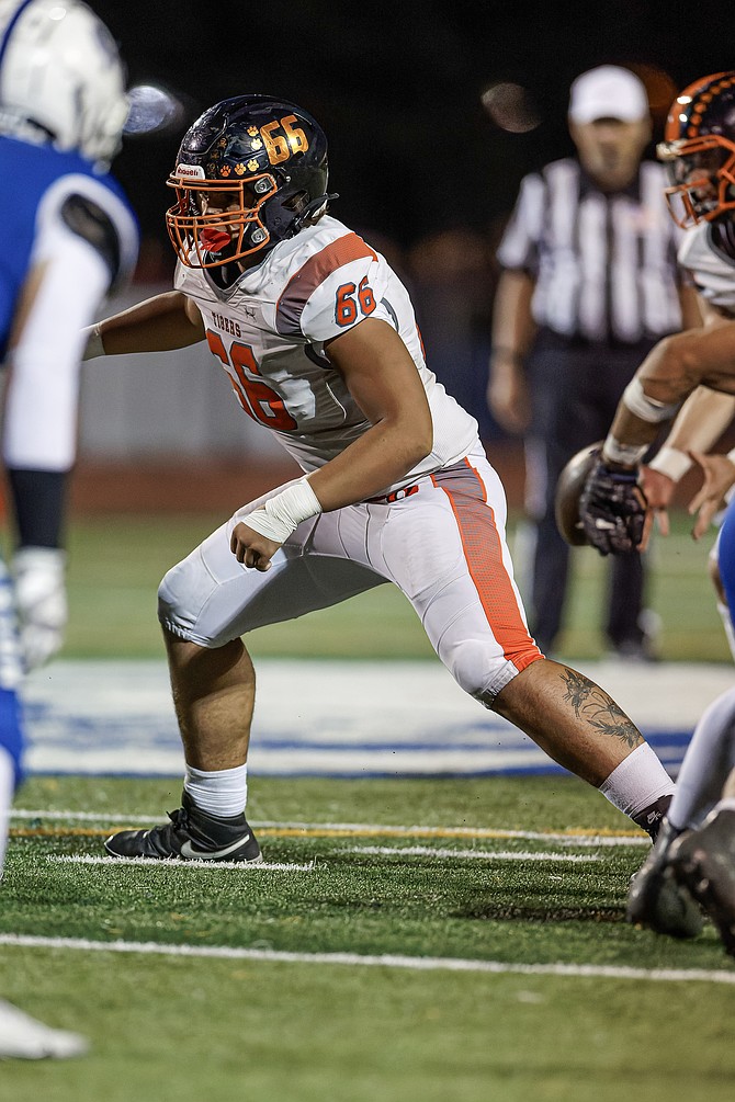 Raiden Barnes (66) blocks against Carson on Friday. Douglas’ offensive line has helped the Tigers score 103 points in the last two games.