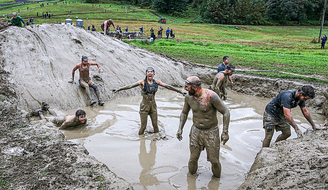 One of the competitors in the Spartan challenge race gives a primal scream after sliding into a mud bog Sunday, Sept. 15 as part of the challenge course. The annual Seattle Spartan obstacle race is held in Monroe, past the high school, on the grounds of the Meadow Wood Equestrian Center. Hundreds of competitors descend upon the edge of Monroe to test their strength and endurance by climbing rope walls, carrying heavy items, running through terrain and more.