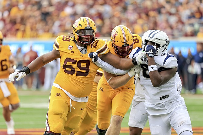 Nevada was pushed around Saturday by offensive lineman Aireontae Ersery (69) and his Minnesota teammates in an easy 27-0 win for the Gophers.