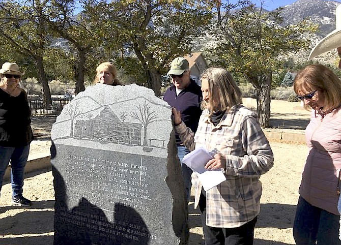 Laurie Hickey leads a tour of the Mottsville Cemetery on Oct. 9, 2021.