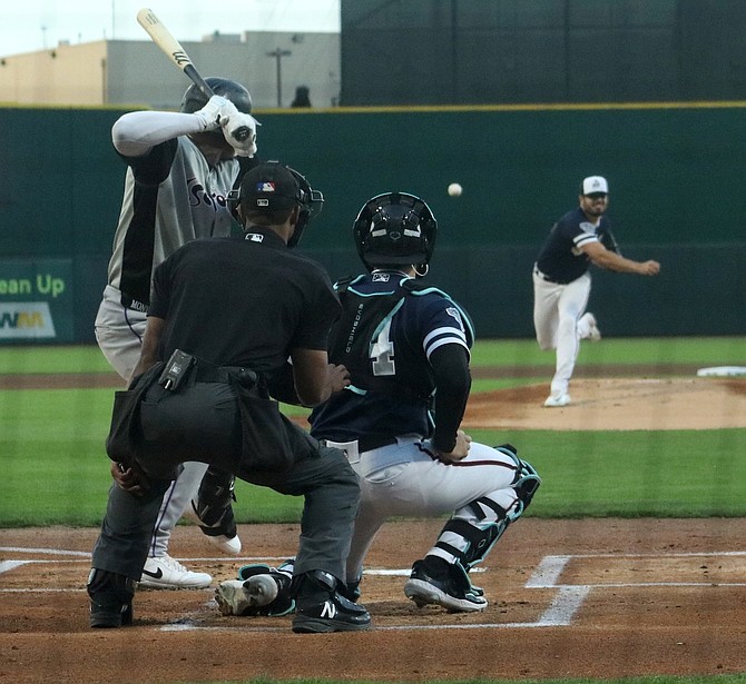 Reno Aces pitcher Hamberto Castelanos throws a strike against Albuquerque’s Elehuris Montero in Thursday’s game at Greater Nevada Field. Reno defeated the Isotopes, 5-3.