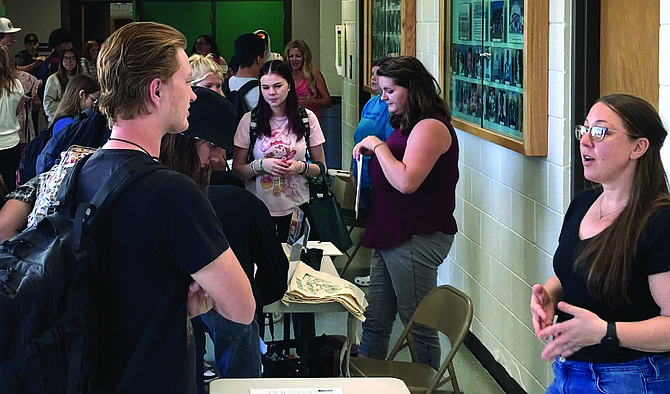 Churchill County High School seniors discuss volunteer opportunities with representatives from the Fallon Theatre, Churchill County Parks and Recreation and the Churchill Community Coalition at the Community Service Fair.