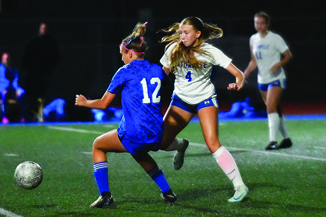 Eatonville's Hannah Hanson looks to steal the ball away from one of Fife's most dangerous attackers, Dasha Vysotskiy. Coach Van Eaton praised Hanson's defensive play in the match.