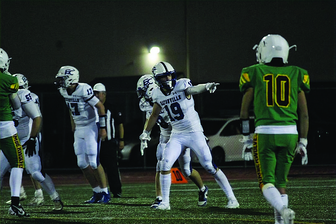 Eatonville's Jacob Simons points to the sideline judge for affirmation he is line up correctly. Simons would thrill the crowd in the 4th quarter by ripping an apparent interception from the defenders hands and ran it in for a touchdown.