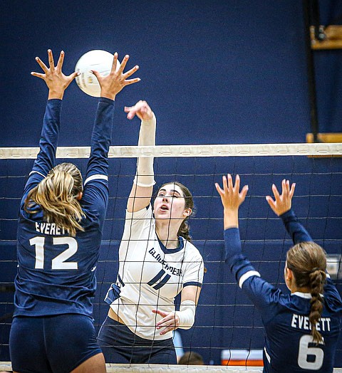 Glacier Peak Grizzly junior Claire Sedenquist tips one during
first game play between Everett  and Glacier Peak on Monday, Sept. 16 at Glacier Peak. Everett Seagulls #6 Emilia Regan Bone, and #12, Julia Martin give defense. 
Glacier Peak swept 3-0 in matches. Ava Nowak, a Grizzly senior, had 26 kill shots during game one.  Ava Urbanoz led the Seagulls with 25 assists, three aces and three digs.