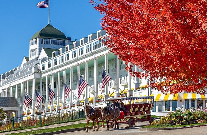 Step back in time at the spectacular Grand Hotel on Mackinac Island, Michigan, which is only accessible by ferry and the main form of transportation on the island is horse and carriage.