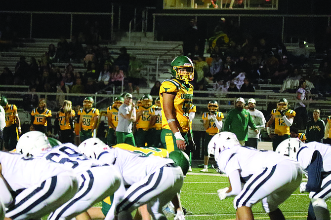 Battle Mountain’s Isaac Martinez looks over the offensive line from his linebacker position.