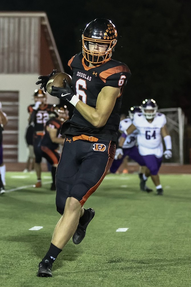 Douglas High senior tight end Dustin Danen (6) hauls in a catch Friday night, during the Tigers' homecoming game against Spanish Springs.