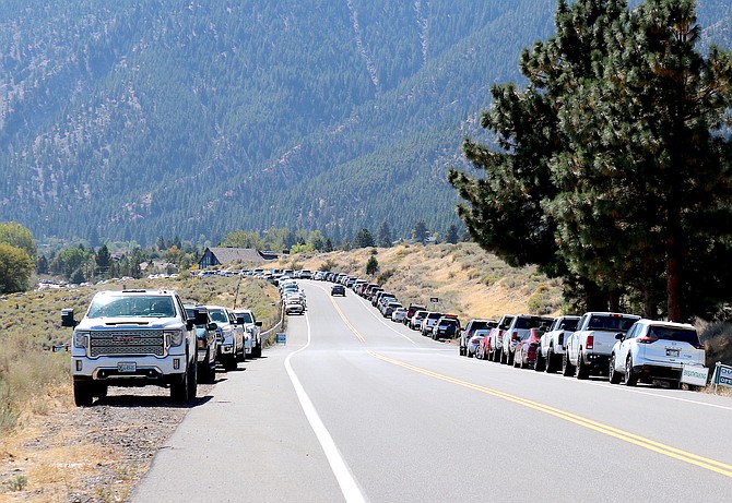 Vehicles were parked Saturday afternoon on either side of Jacks Valley Road two miles from Genoa and at least a mile from the Genoa Cemetery shuttle stop.