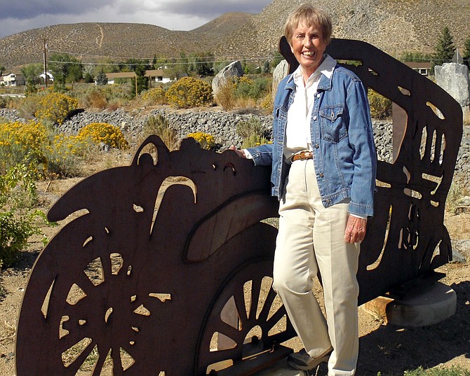 Standing beside one of the metal cars depicting the arrival of Lt. Col. Ike Eisenhower’s convoy through the Arrowhead interchange is Mary Fischer, the impetus behind the outdoor art along Carson’s I-580.