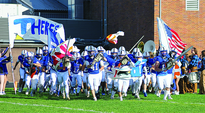 With chainsaws revving and the crowd cheering, the Eatonville Cruiser football team takes the field prior to the Homecoming game against the Foss Falcons this past Thursday evening. The Cruisers would defeat the Falcons 45-20 to improve to 4-0 on the year.