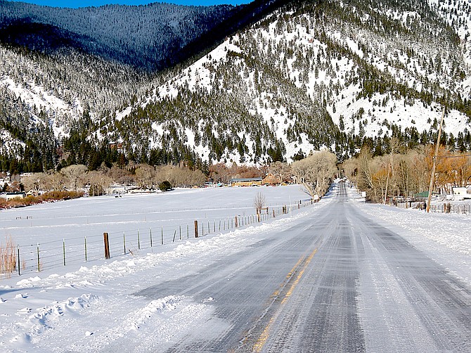 Snow drifts onto an icy Genoa Lane on March 3, 2024, after 13 inches of snow fell in Minden.