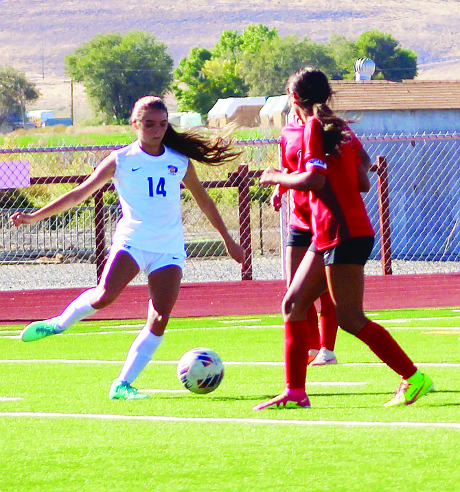 Lowry’s Kepa Hilbish puts a shot on goal during the Lady Bucks’ match with Pershing County on Sept. 24, in Lovelock.