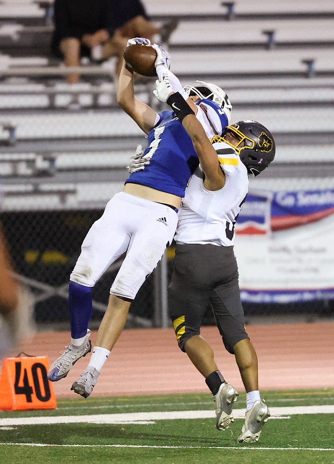 Carson High wide receiver Zack Eaton rises up to make a back shoulder catch Friday night against Galena. The catch setup a Senator field goal, but the Grizzlies finished the night on top, winning 35-12.