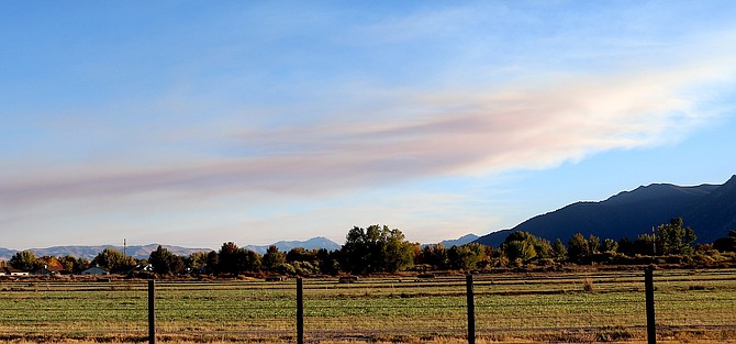 A light smoke plume crosses the sky in Carson Valley on Thursday evening from the Peak Fire.