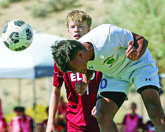 Lowry’s Joao Lisboa heads a shot toward the goal during Friday’s away match against Elko.