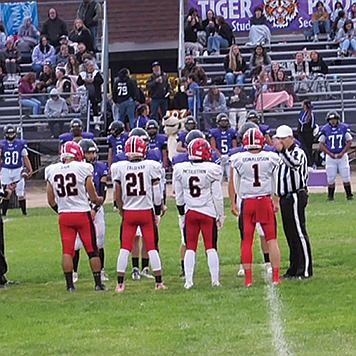 Pershing County seniors Tyrn Sam (32), Denzel Zaldivar (21), Izayuh McGlothin (6) and Travis Donaldson (1) square off against Portola earlier this year.