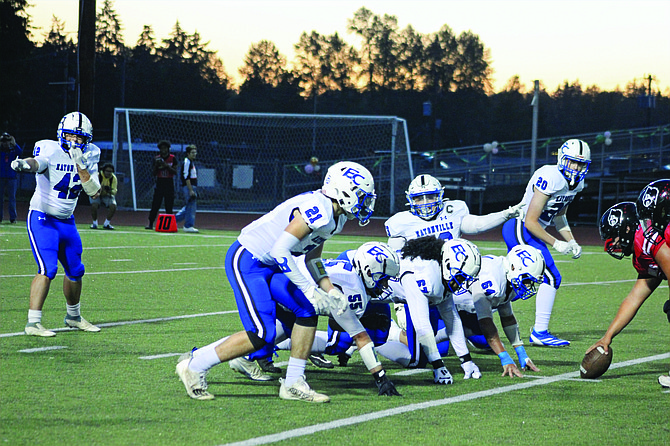 Eatonville linebacker Logan Shipman (#42) and defensive lineman Aaron Tozier (#73) shout out some pre-snap communication against Franklin Pierce.