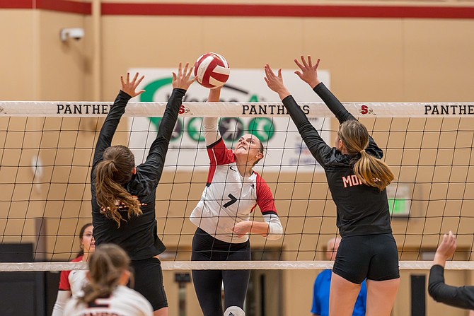 Snohomish’s Heidi Chambers gets a kill by hitting between two Monroe blockers during a matchup Monday, Sept. 30 at Snohomish High. Snohomish won all three sets against the strong Bearcats. Snohomish’s Heidi Chambers led the Panthers with 23 kills and Keira Beverford led the Panthers with 15 digs. Snohomish’s Maggie Cavanaugh led the way with 31 assists. Snohomish is 3-4 overall, 2-1 league as of press time Monday, Oct. 7. Monroe is 6-1 overall, 2-1 league as of Monday, Oct. 7.