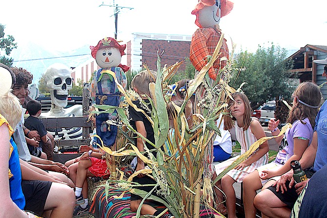 Hay riders enjoy a trip around Eddy Street and Courthouse courtesy of Dwight and Diana Borges during the Fall Festival on Saturday.