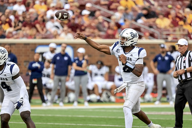 Nevada quarterback Brendon Lewis throws a pass against Minnesota last month in Minneapolis.