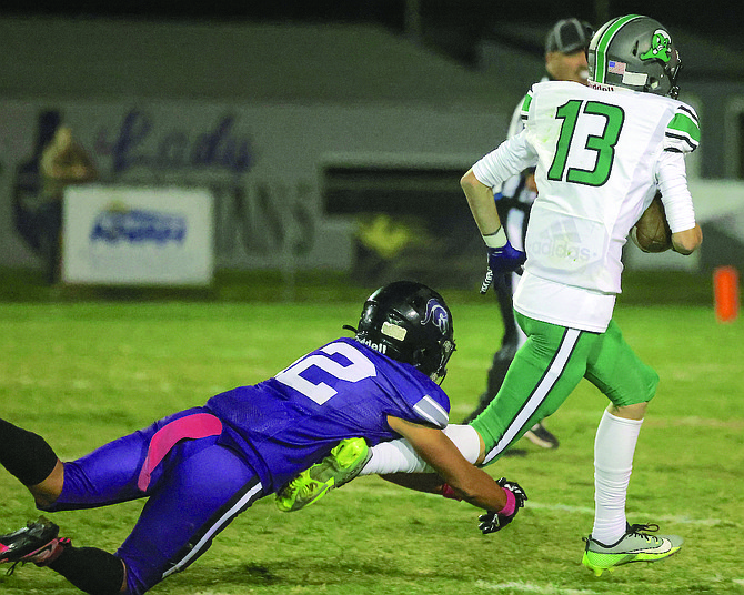 Fallon’s Calin Anderson (13) picks up big yardage after hauling in a pass during the Greenwave's win at Spring Creek.