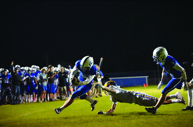 Eatonville's Ky Nation stretches the ball over the goal line for the Cruisers first touchdown of the night. Eatonville would defeat the Fife Trojans 32-7 this past Thursday night.