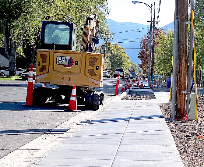 There's a new sidewalk along parts of 10th Street in Minden. Workers have the driveway to The R-C's offices blocked to pour the driveway. Also road maintenance is scheduled to take place today.