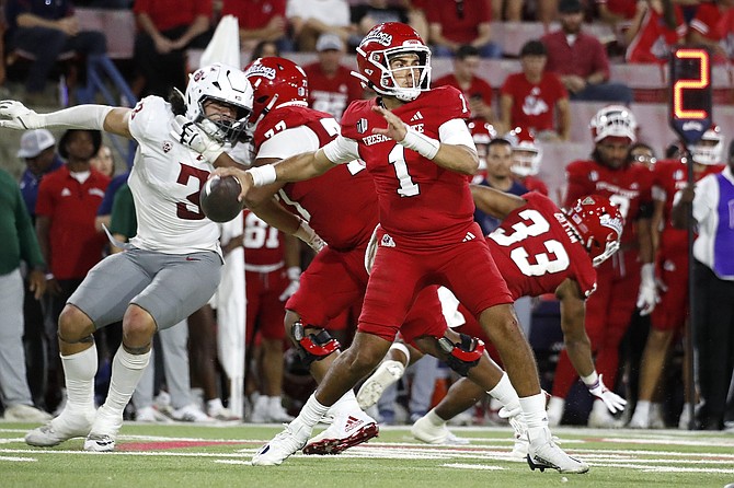 Fresno State quarterback Mikey Keene drops back against Washington State last week. He has eight TDs and eight interceptions for the season.