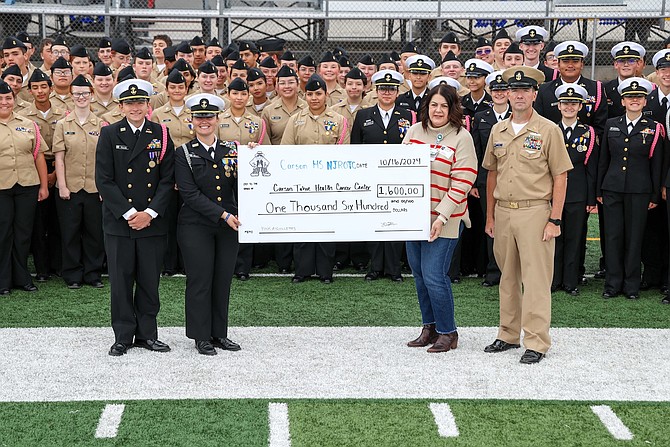 Carson High School NJROTC Officers Gideon Feuling and Neva Mellow with Carson Tahoe's Philanthropy Specialist Tami Stein and Carson High’s Senior Chief Jerry Skirvin.