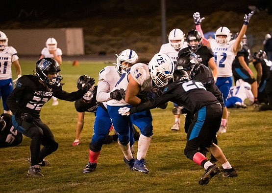 Carson High's Angelo Macias (25) crosses the goal line with 12 seconds left to play, giving the Senators their first lead of the evening in a 27-21 win over North Valleys.