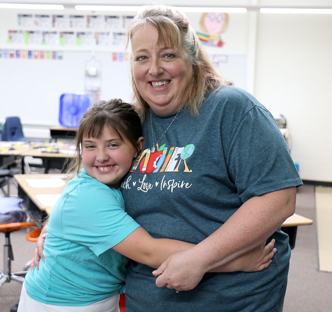 Fourth grader Morgann Kawaratani hugs Empire Elementary School teacher Kendra Ciccarelli at the school’s meet-and-greet event in August 2024.