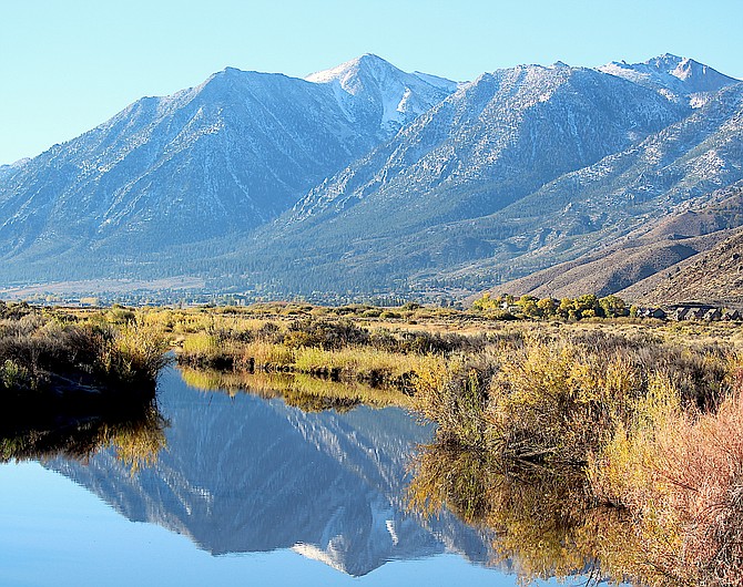 A light dusting of snow could be seen on Jobs Peak reflected in Brockliss Slough off Genoa Lane on Friday morning.