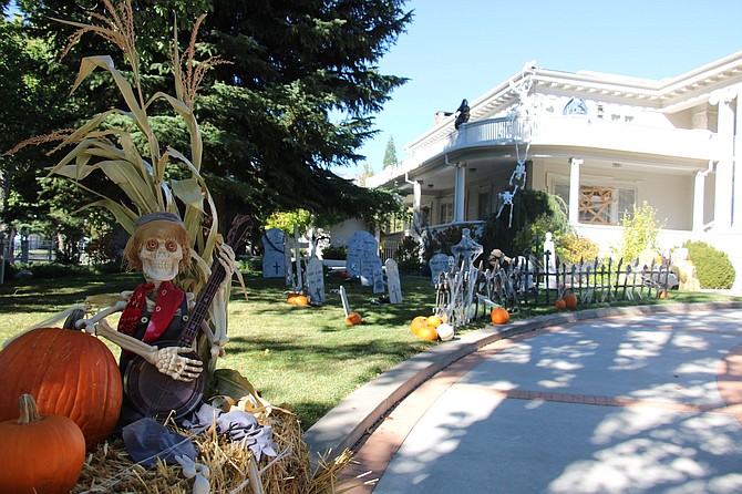 A ghoulish banjo player guards a graveyard at the southeast corner of the Governor’s Mansion in Carson City on Oct. 18.