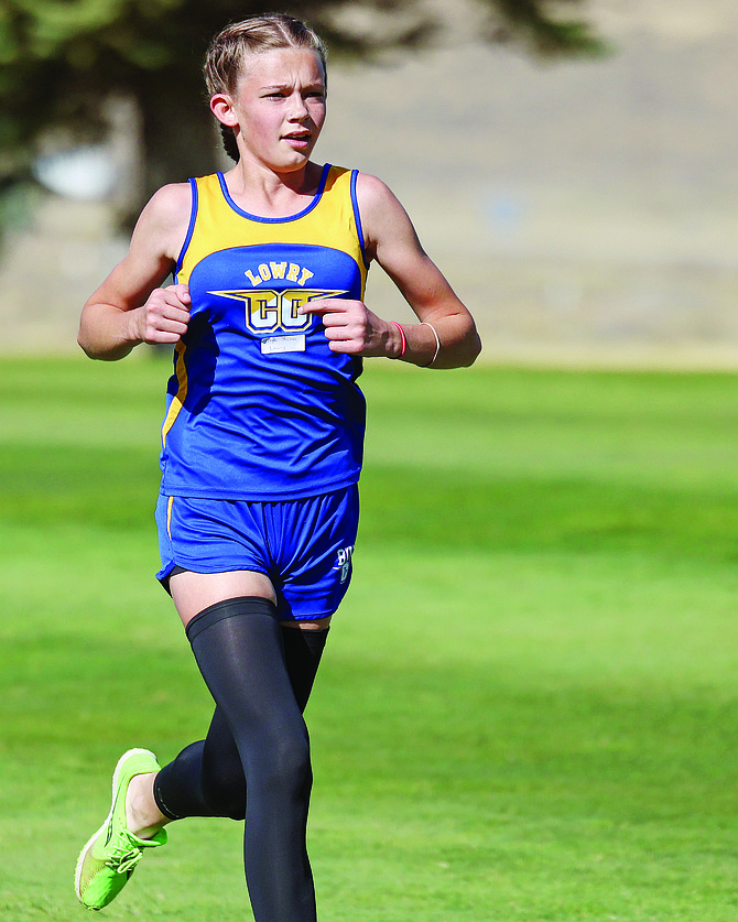 Lowry’s Alyla Thomas race at the Wells Invitational on Friday Chimney Creek Golf Course. Thomas finished second in the girls 5,000-meter girls race.