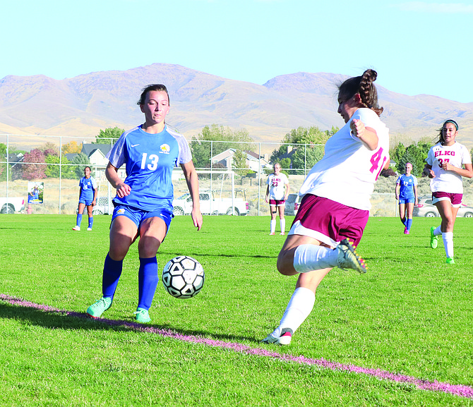 Lowry's Damiena Mentaberry battles for control of the during a match with Elko earlier in the year,