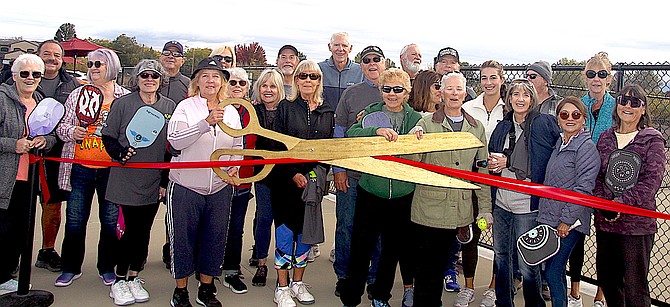 Pickleball enthusiasts cut the ribbon Thursday during the grand opening of the new Pickleball facility at the Doulas County Community and Senior Center.