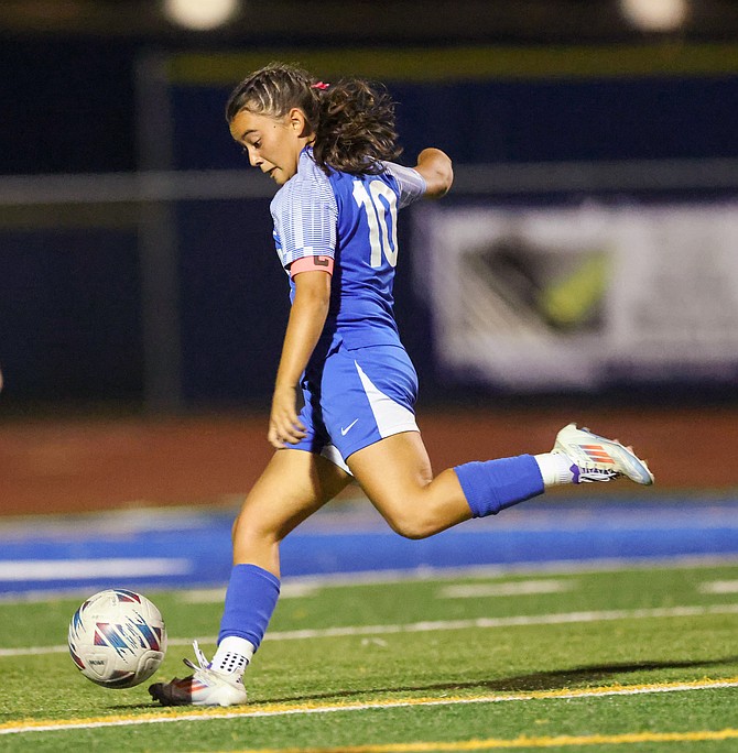 Carson High’s Alondra Carillo winds up to shoot Tuesday against Douglas. Carillo netted a hat trick in a 6-2 win.