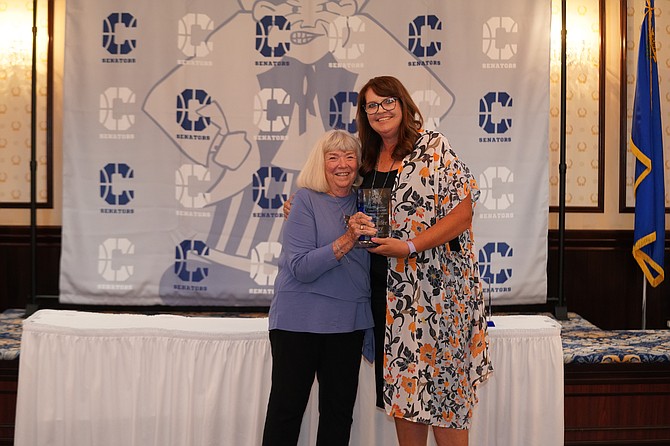 Jennifer Gray stands next to Cheryl Stoddard after receiving her award for being inducted into the Carson High School basketball Hall of Fame last Saturday at the Governor’s Mansion. Gray finished her Senator career with a record of 109-7 as Carson won two state titles in AAA in 1989 and 1990. She was also named the AAA state player of the year in 1990.