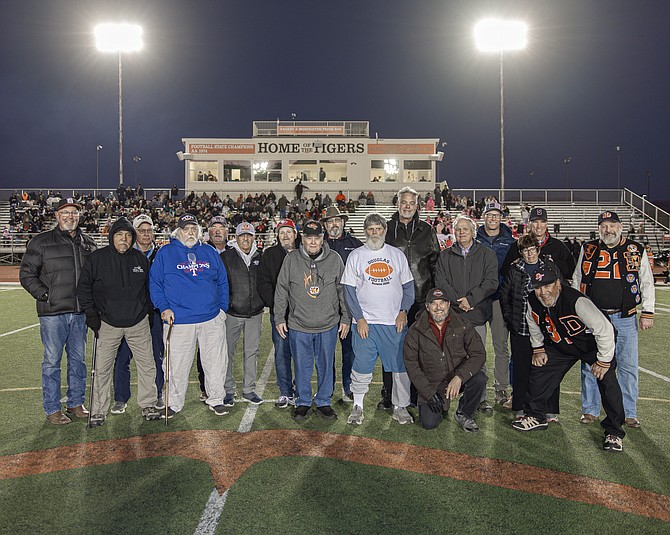 More than a dozen members of the 1974 Douglas High football team were recognized Friday for their 1974 state title, which remains the only title in program history.