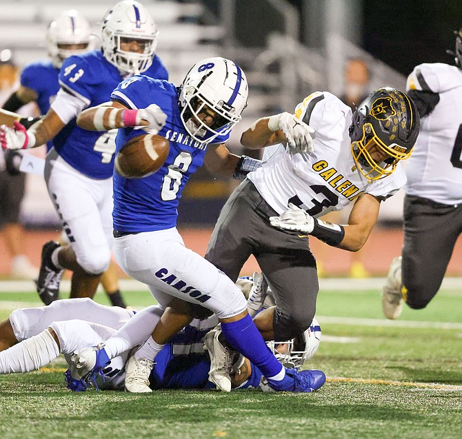 Carson High’s Kekoa Mitchell (6) strips the ball from a Galena player earlier this season. Mitchell has two interceptions, including one last week that helped the Senators prevail 27-21 over North Valleys.