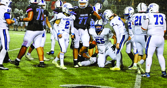 Eatonville's Nick Shipman (#55) is all smiles after recovering a Washington fumble inside the Cruiser red zone and thwarting a Patriot score.