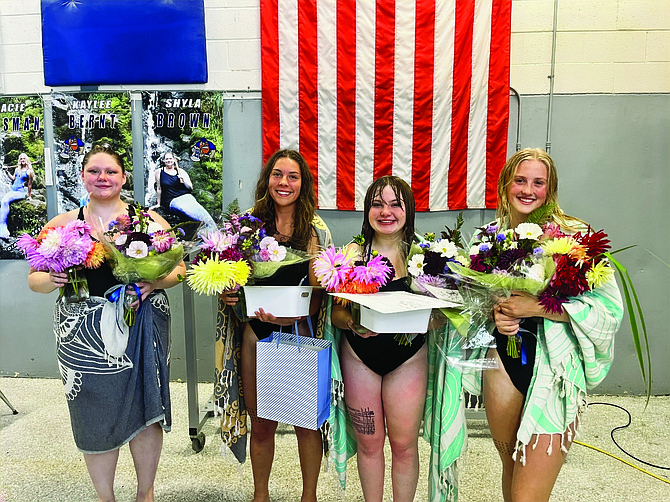 Eatonville’s four seniors pose for a photo after being honored on Senior Night.