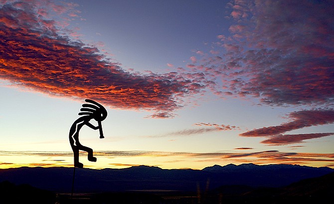 'Kokopelli rocks out' on Monday morning as the sky turns red, white and blue in this photo by TRE resident John Flaherty.