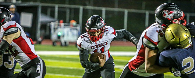 Mountlake Terrace Hawks sophomore running back Mason Wilson drives through a large hole behind his blockers in the Hawks’ dominant 34 - 0 win over the Everett Seagulls on Friday evening at Everett’s home turf. The Hawks led by 14 in the first period and scored in every period of the evening. Mountlake Terrace showed a strong defense on the ground and intercepted two of the Seagulls passes.  The Seagulls celebrated a soggy Homecoming at the half.
Everett’s season stood at 1-5 league, 1-6 overall in Wesco 3A South. The Seagulls’ sole win so far was a 20-14 victory over Edmonds-Woodway (1-4 league, 2-5 overall) in September.