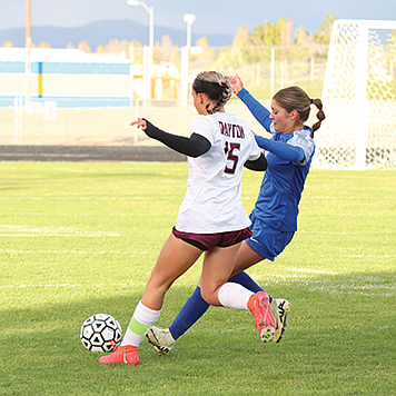 Lowry's Nevaeh Gerhard chases down a loose ball against Dayton.