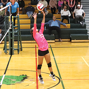 Pershing County’s Mia Canchola sets the ball for a teammate.