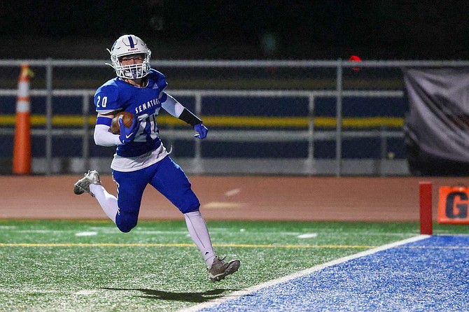 Carson High's Jake Weninger crosses into the end zone on one of his two touchdowns Friday night, during the Senators' 16-14 loss to Damonte Ranch. Weninger returned the opening kickoff of the second half for a touchdown and scored again on a 47-yard reception.