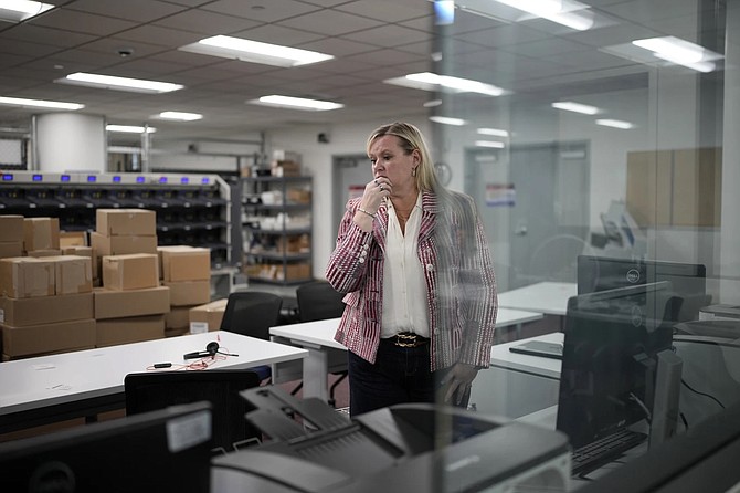 Cari-Ann Burgess, then-Washoe County interim registrar of voters, pauses Sept. 20, 2024 in Reno while helping prepare the office for elections.