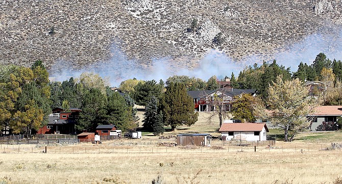 Smoke pours through Alpine View on Sunday morning.